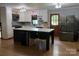 Modern kitchen featuring a large kitchen island with bar seating, updated appliances, and lots of natural light at 1909 Normandy Rd, Kannapolis, NC 28081