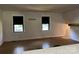 Bright living room with hardwood floors and abundant natural light from two large windows at 1909 Normandy Rd, Kannapolis, NC 28081
