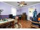 Multi-purpose bedroom featuring hardwood floors and a ceiling fan at 1920 E Nc Hwy 24/27 None, Biscoe, NC 27209