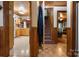 Inviting hallway with hardwood and laminate flooring, with access to the kitchen, living room, and stairs at 1920 E Nc Hwy 24/27 None, Biscoe, NC 27209