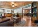 Cozy living room with wood-paneled ceiling, hardwood floors, and an open layout to the kitchen at 1920 E Nc Hwy 24/27 None, Biscoe, NC 27209