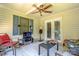 Outdoor screened porch perfect for entertaining, featuring comfortable seating and a serene backyard view at 1920 E Nc Hwy 24/27 None, Biscoe, NC 27209