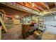 Unfinished basement featuring exposed wood ceiling and open storage space, perfect for customization at 207 W 21St St, Kannapolis, NC 28081
