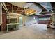 Unfinished basement with concrete floors and access to a garage, offering potential for storage at 207 W 21St St, Kannapolis, NC 28081