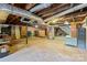 Spacious unfinished basement with concrete floor and exposed ductwork at 207 W 21St St, Kannapolis, NC 28081