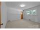 Cozy bedroom with carpet, natural light from a double window and neutral paint at 207 W 21St St, Kannapolis, NC 28081