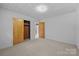 Bedroom with carpet, two closets, and neutral paint at 207 W 21St St, Kannapolis, NC 28081
