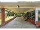 Spacious covered parking with brick foundation, suitable for multiple vehicles with backyard views at 207 W 21St St, Kannapolis, NC 28081