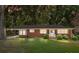 Charming one-story brick home featuring a well-maintained lawn and cozy covered parking at 207 W 21St St, Kannapolis, NC 28081