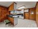 Bright kitchen with wood-paneled accent walls, and an open layout including updated white cabinets and countertops at 207 W 21St St, Kannapolis, NC 28081