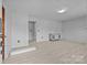 Bright living room with laminate floors and white walls at 207 W 21St St, Kannapolis, NC 28081