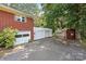 View of the property with multiple outbuildings and garage in the backyard at 207 W 21St St, Kannapolis, NC 28081