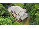Detailed aerial view of a multi-story home showcasing roof lines, decks, landscaping and surrounding trees at 2156 Wedgewood Dr, Matthews, NC 28104