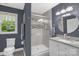 Modern bathroom with glass-enclosed shower, granite countertop vanity, and stylish fixtures at 2156 Wedgewood Dr, Matthews, NC 28104