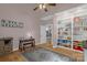 Bedroom with light-colored walls, hard wood floors, vaulted ceiling, built-in shelves and a cozy rug at 2156 Wedgewood Dr, Matthews, NC 28104