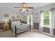 Bedroom featuring neutral carpet, decorative wall trim, and windows that provide ample natural light and privacy at 2156 Wedgewood Dr, Matthews, NC 28104