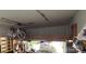 Well-organized garage with ample storage space, including overhead shelving and a car lift at 2156 Wedgewood Dr, Matthews, NC 28104
