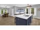 Spacious kitchen featuring a large island with seating, stainless appliances, and open view to the dining area at 2156 Wedgewood Dr, Matthews, NC 28104