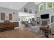 Open floor plan with living room, fireplace, and view into the kitchen area at 2156 Wedgewood Dr, Matthews, NC 28104