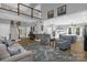 Spacious living area with staircase, leading to a kitchen and dining area at 2156 Wedgewood Dr, Matthews, NC 28104