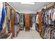 This walk-in closet offers ample shelving and hanging space to keep clothing and accessories organized at 2156 Wedgewood Dr, Matthews, NC 28104