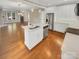 Open-concept kitchen featuring a large island with stainless steel appliances at 2222 Camp Greene St, Charlotte, NC 28208