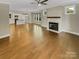 Open living space with hardwood floors, a fireplace, and lots of light at 2222 Camp Greene St, Charlotte, NC 28208