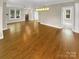 Large living area with hardwood floors and bright natural light at 2222 Camp Greene St, Charlotte, NC 28208