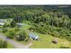 Aerial view of home with large wooded area, metal roof, and large yard at 223 Green Meadows Dr, Kings Mountain, NC 28086