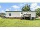 Back of home with wooden deck and green lawn at 223 Green Meadows Dr, Kings Mountain, NC 28086