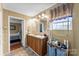 Bathroom featuring double sink vanity with good natural light and tile flooring at 223 Green Meadows Dr, Kings Mountain, NC 28086