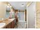 Bright bathroom with double sinks and a separate glass-enclosed shower stall at 223 Green Meadows Dr, Kings Mountain, NC 28086