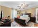 Comfortable bedroom with a dark wood frame bed and matching furniture set at 223 Green Meadows Dr, Kings Mountain, NC 28086