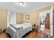 Bright bedroom with wood floors and a decorative side table at 223 Green Meadows Dr, Kings Mountain, NC 28086