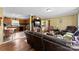Inviting living room featuring hardwood floors, comfortable seating, and seamless flow into the kitchen at 223 Green Meadows Dr, Kings Mountain, NC 28086