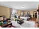 Comfortable and warm living room space featuring cozy seating, a large window, and hardwood flooring at 223 Green Meadows Dr, Kings Mountain, NC 28086