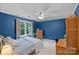 Comfortable bedroom has large window, ceiling fan, and neutral carpet; ideal for relaxation and rest at 2358 Sparrow Dr, Rock Hill, SC 29732