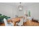 Dining room with chandelier, wooden table, upholstered chairs, and hardwood floors at 2358 Sparrow Dr, Rock Hill, SC 29732