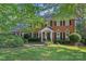 Beautiful two-story brick home with manicured lawn and mature trees at 2358 Sparrow Dr, Rock Hill, SC 29732
