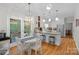 Bright, open kitchen featuring white cabinets, stainless appliances, and a breakfast bar at 2358 Sparrow Dr, Rock Hill, SC 29732