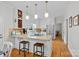 Inviting kitchen with island, barstool seating, stainless appliances and a built-in wine rack at 2358 Sparrow Dr, Rock Hill, SC 29732