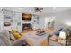Spacious living room featuring a fireplace, hardwood floors, and built-in shelving at 2358 Sparrow Dr, Rock Hill, SC 29732