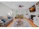 Cozy living room featuring a fireplace, built-in shelves, and hardwood floors at 2358 Sparrow Dr, Rock Hill, SC 29732