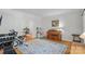 Bright room featuring an exercise bike, free weights, wooden floors, and a decorative rug at 2358 Sparrow Dr, Rock Hill, SC 29732