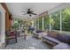 Relax on this screened porch with a ceiling fan, wicker furniture, and views of the backyard at 2358 Sparrow Dr, Rock Hill, SC 29732