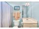 Cozy bathroom with blue walls, a neutral vanity, and a shower with a curtain at 2455 Talbot Ct, Sherrills Ford, NC 28673