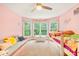 Bright bedroom featuring carpet, windows, a small couch, and a colorful bed at 2455 Talbot Ct, Sherrills Ford, NC 28673