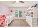 Bright bedroom with ceiling fan, large window, bed, and a white dresser with storage at 2455 Talbot Ct, Sherrills Ford, NC 28673