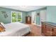 Bedroom featuring plush carpet, a window overlooking greenery, and classic wood dressers at 2455 Talbot Ct, Sherrills Ford, NC 28673