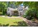 Well-maintained two-story home with stone accents, inviting front porch, and meticulously landscaped front yard at 2455 Talbot Ct, Sherrills Ford, NC 28673